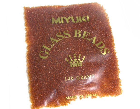 100 gr. Rocallas 11/0 Miyuki - Transp. Dark Topaz - 133 - - Crystaldreams Abalorios