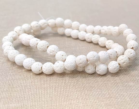 Tira cuentas lava blanca sin cerado redondas 6mm aguj:1mm 62pzs - - Crystaldreams Abalorios