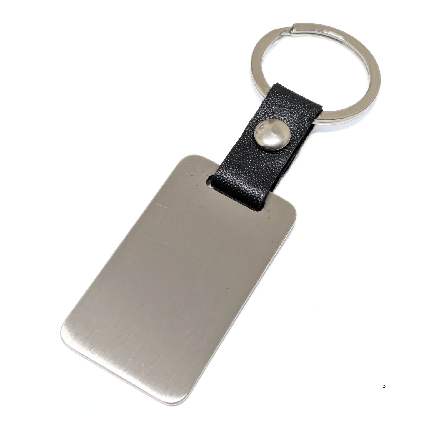 Llavero personalizable en Cuero PU negro, chapa 50x28 mm color Acero con Anilla