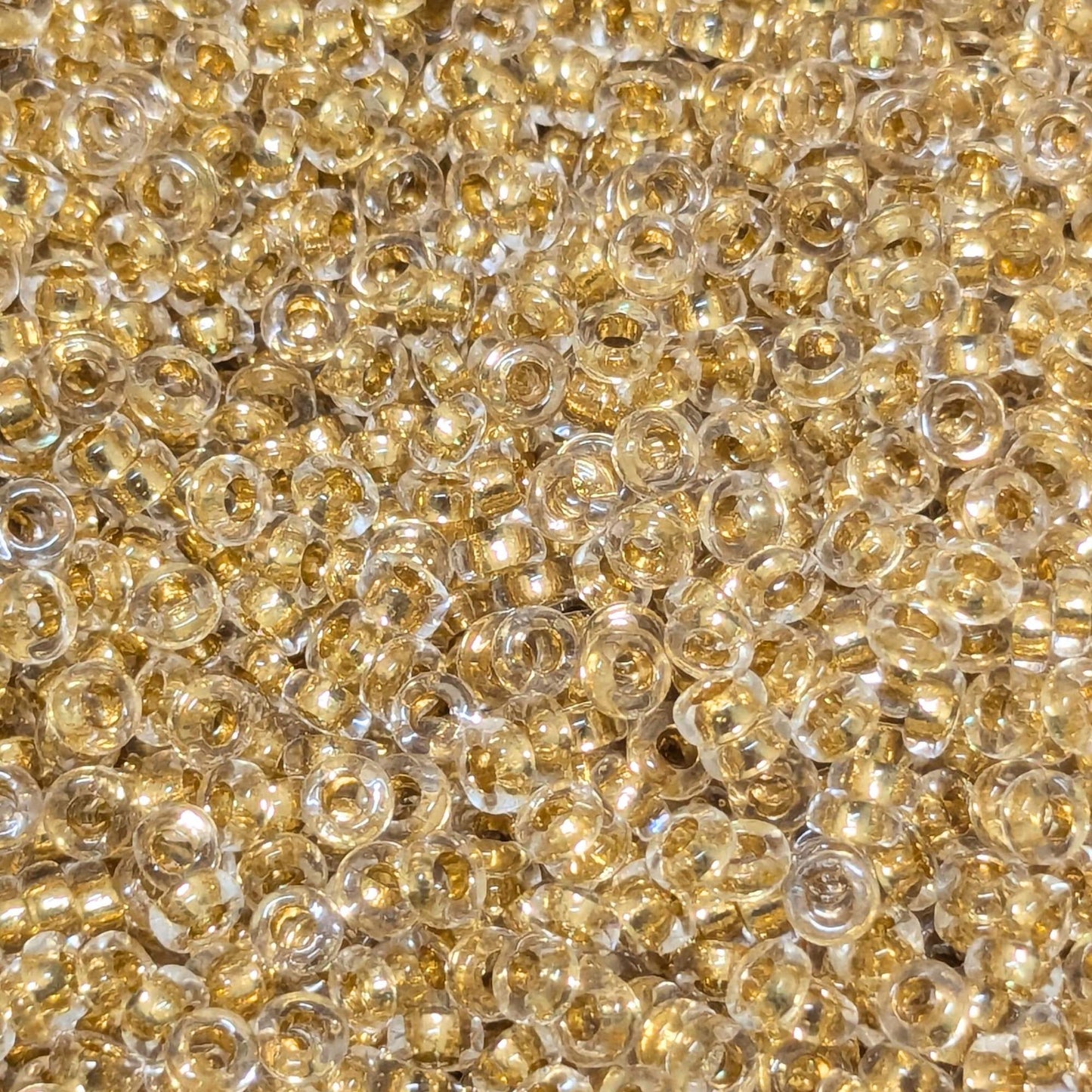 Distanciadores Miyuki 2,2 mm x 1,3 mm 24Kt Gold Lined Crystal - Col. 195