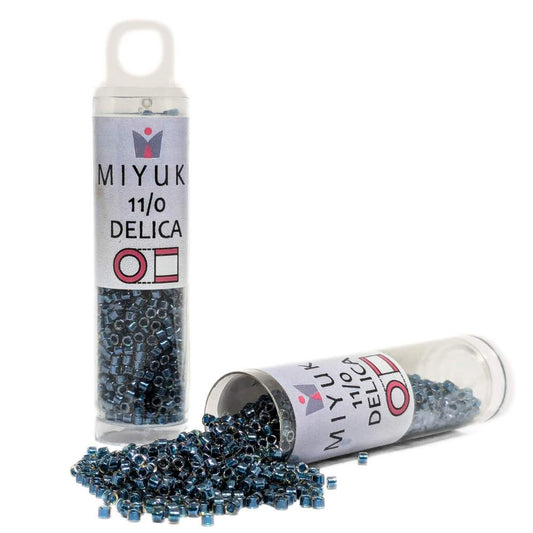 DB0921 Tubo Miyuki Delica 11/0 Sparkling Teal Lined Topaz 7,2gr. -  